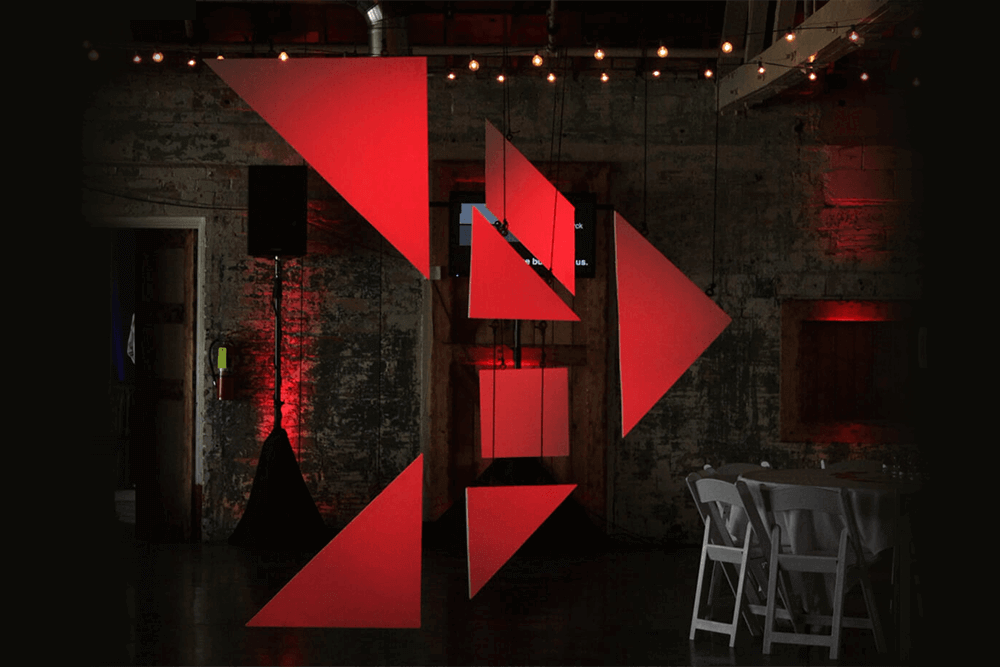 Tangram arrow hanging from ceiling at the OTA:Bismarck event